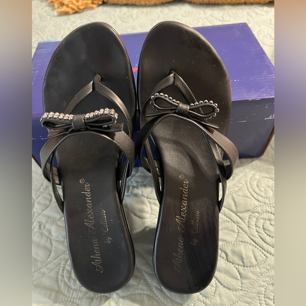 Black strappy wedge sandal.